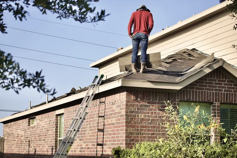 Professional roofer working on a residential roof in South Oak Park